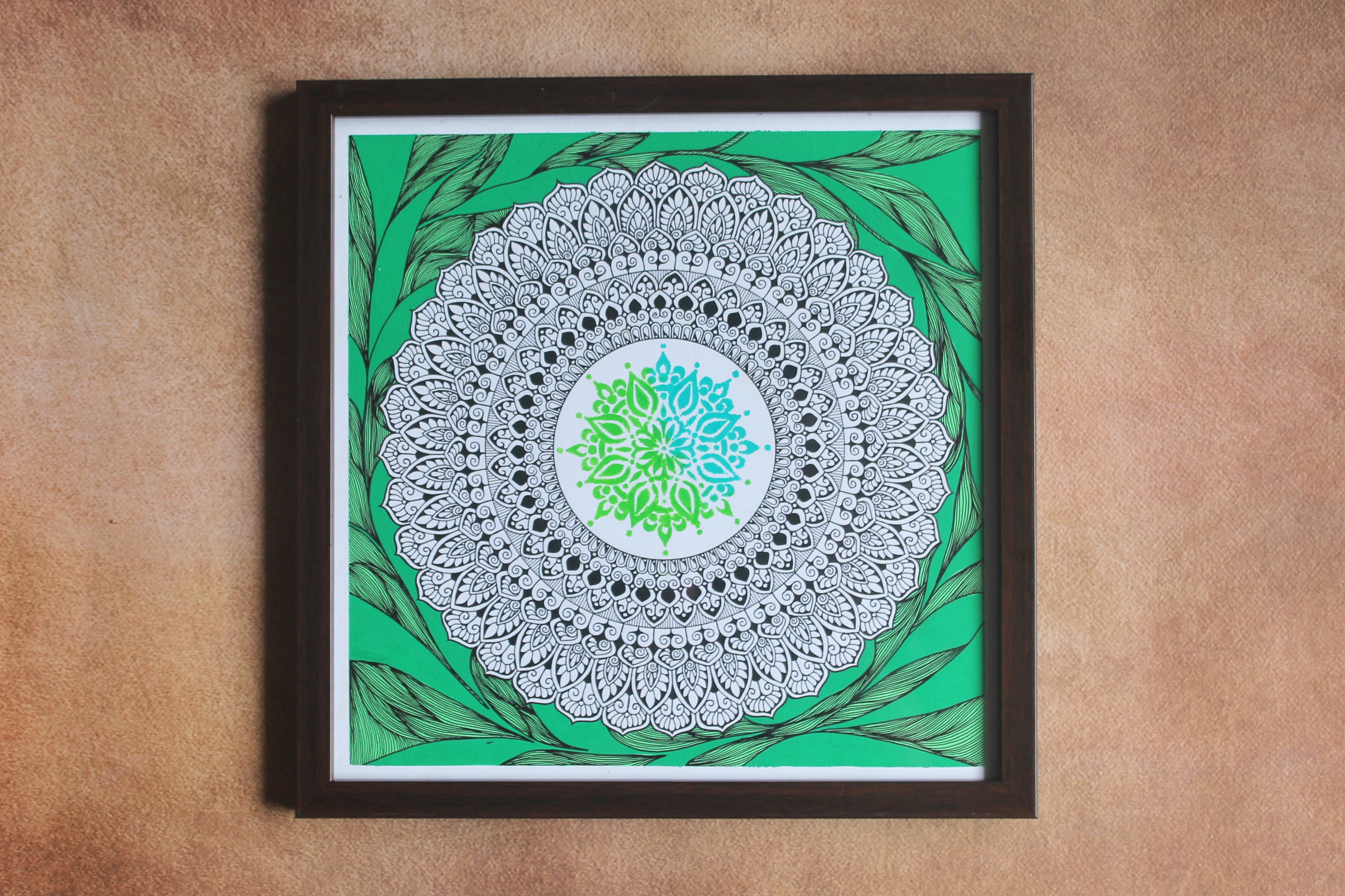 Green and white hand-drawn framed mandala wall decor