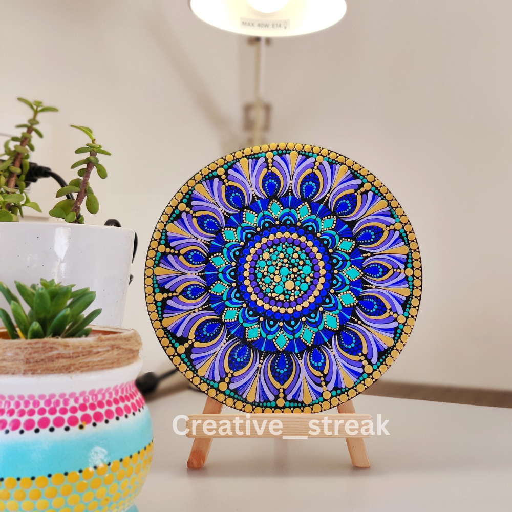 Celestial Blue hand-painted dot mandala on a tabletop stand